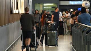 Passengers arrive at Melbourne international airport.