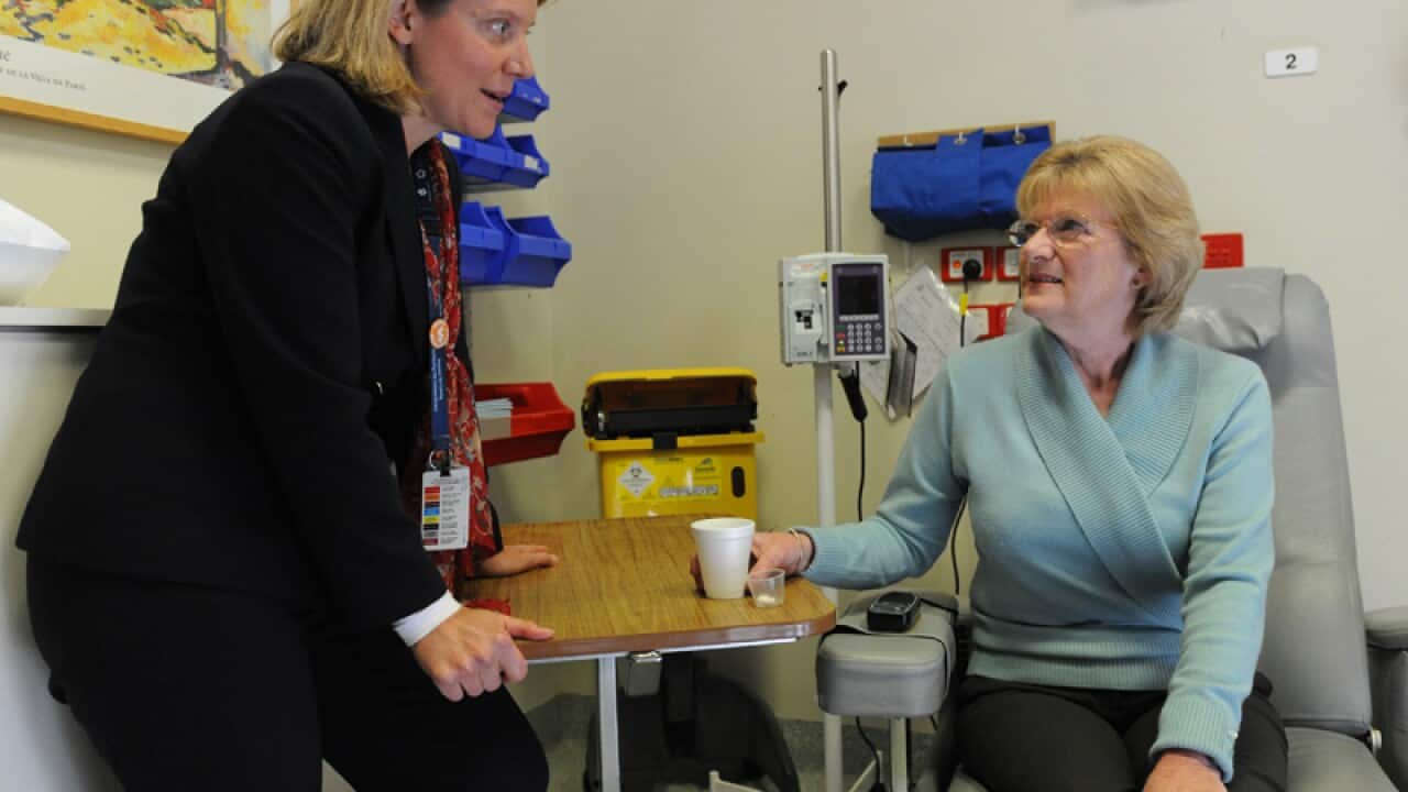 A cancer patient consulting with her doctor