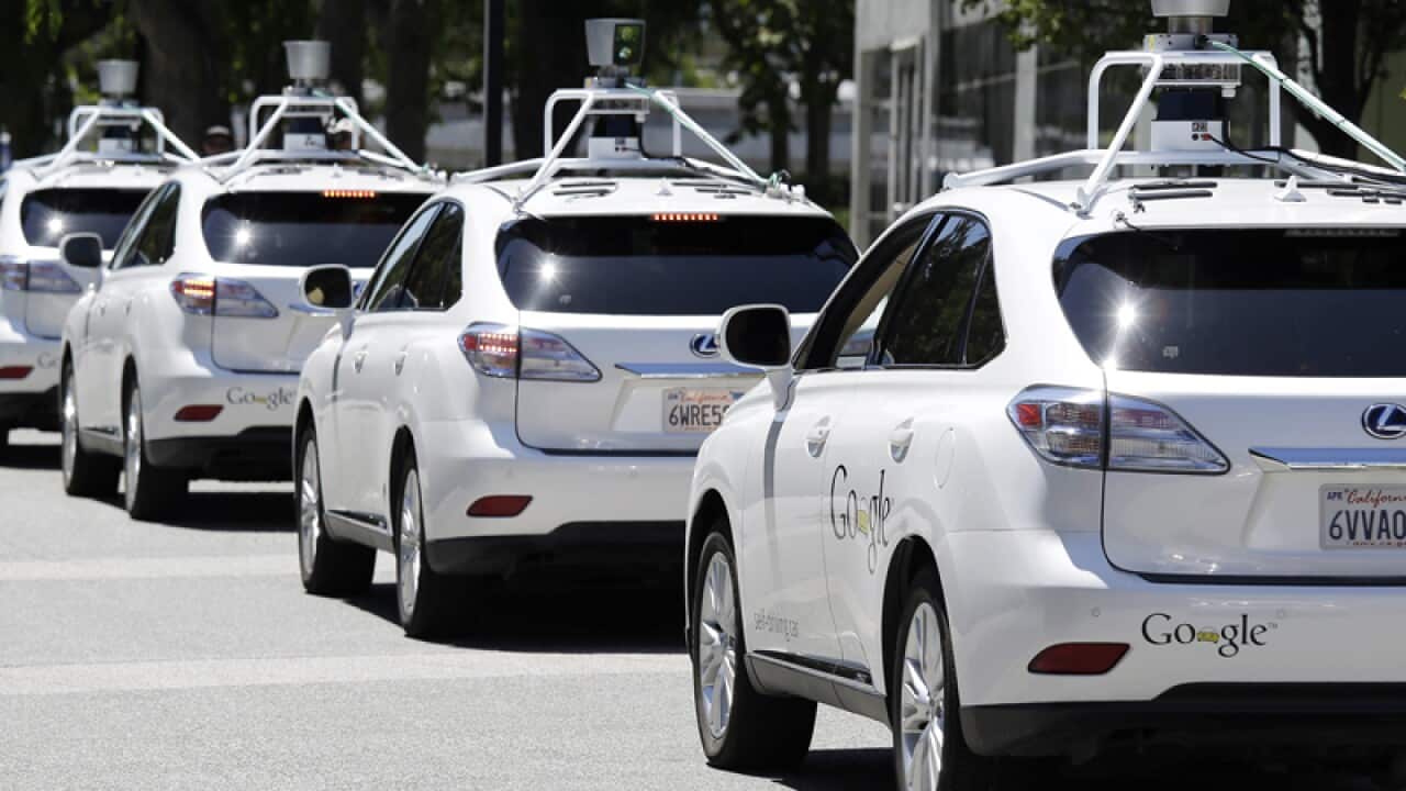 A row of Google self-driving cars