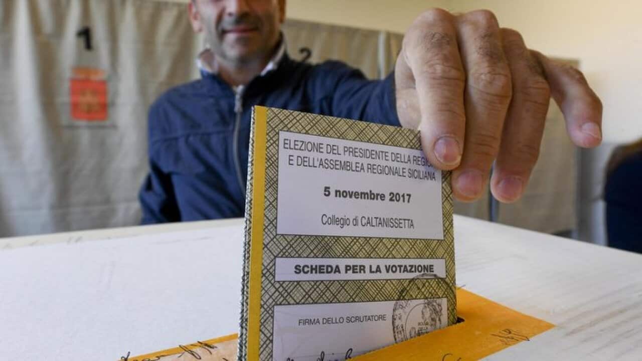 A man votes in a polling station in Palermo, Sicily Region, Italy, 05 November 2017. Sicilians are voting for the presidency of Sicily Region.