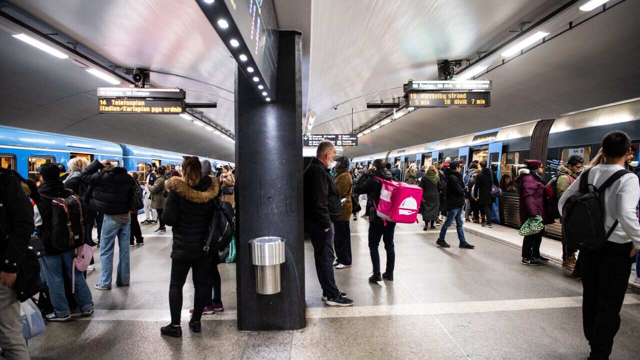 A file photo of commuters waiting to catch trains during rush hour at the Stockholm Central metro station, Sweden.