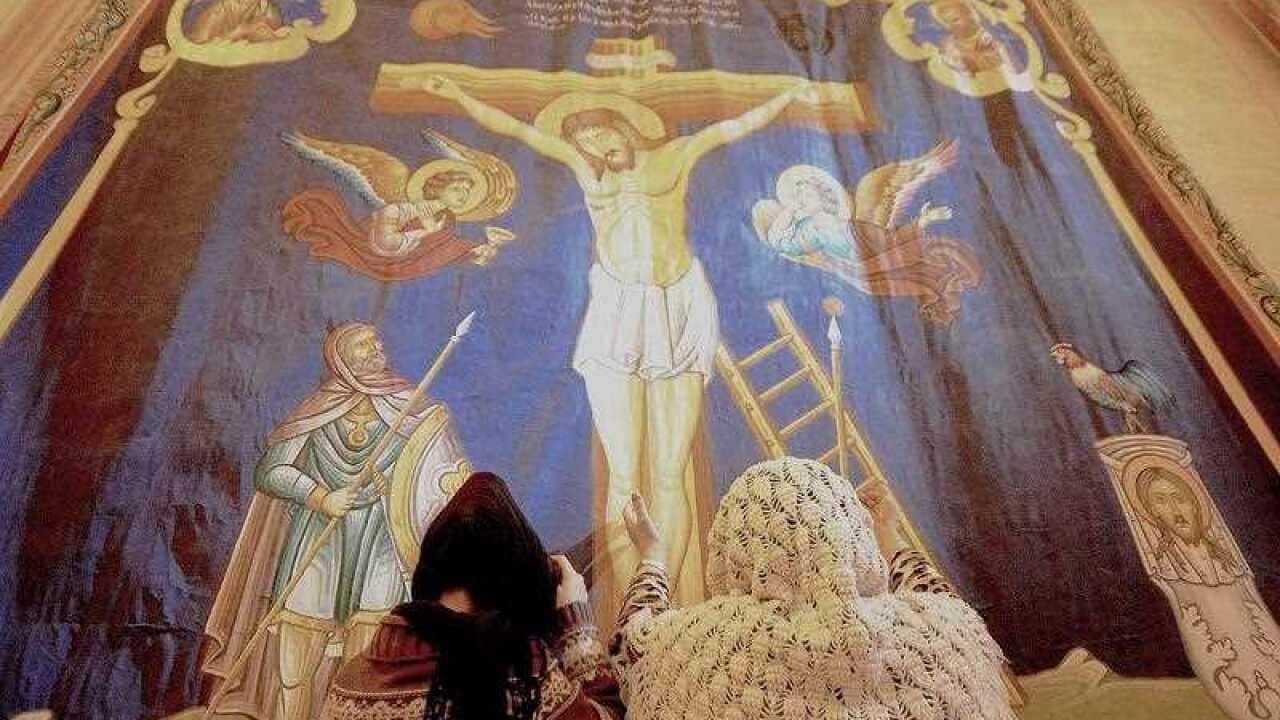 Worshippers pray in the Church of Mor Cercis in the Mardin province, Turkey