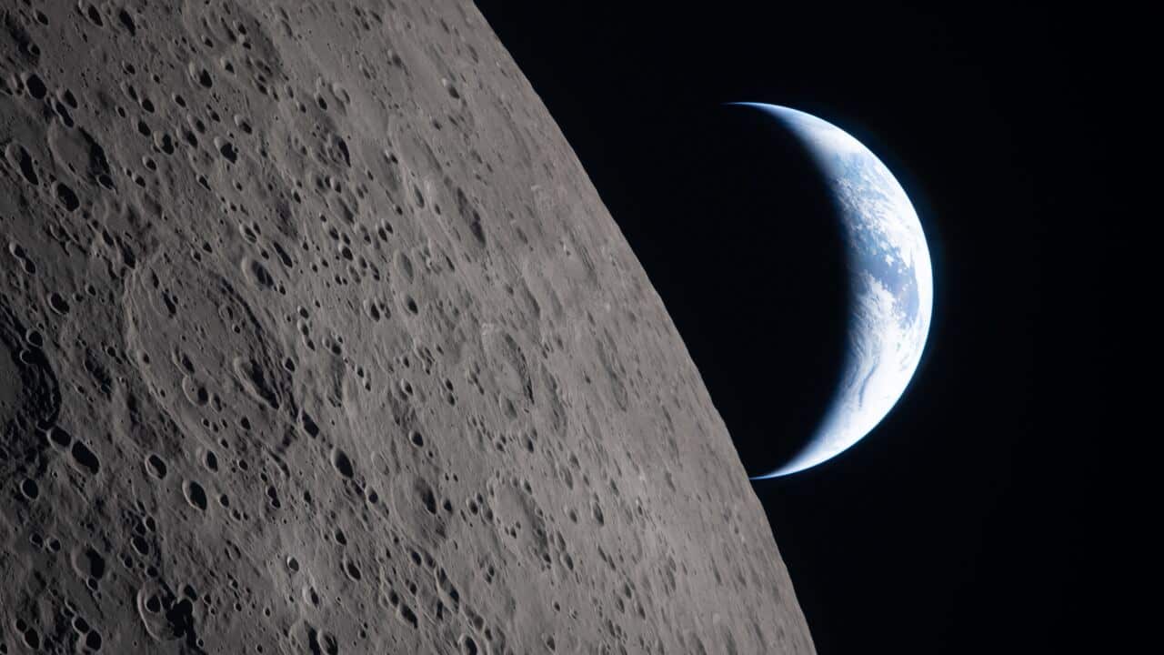 In this image provided by NASA, the Artemis II crew captured this view as the Earth sets behind the Moon during a lunar flyby, Monday, April 6, 2026