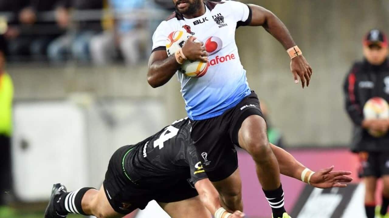 Henry Raiwalui of Fiji tackled by Nelson Asofa-Solomona of New Zealand