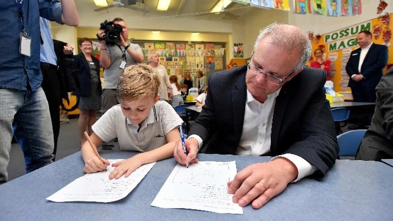 Prime Minister Scott Morrison during a visit to Galilee Catholic Primary School in Sydney. AAP