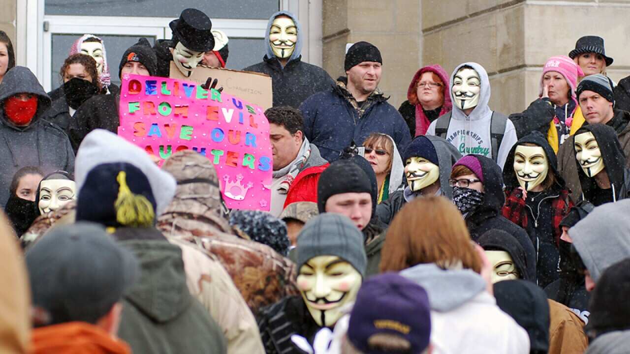 Activists from the computer hacking group Anonymous