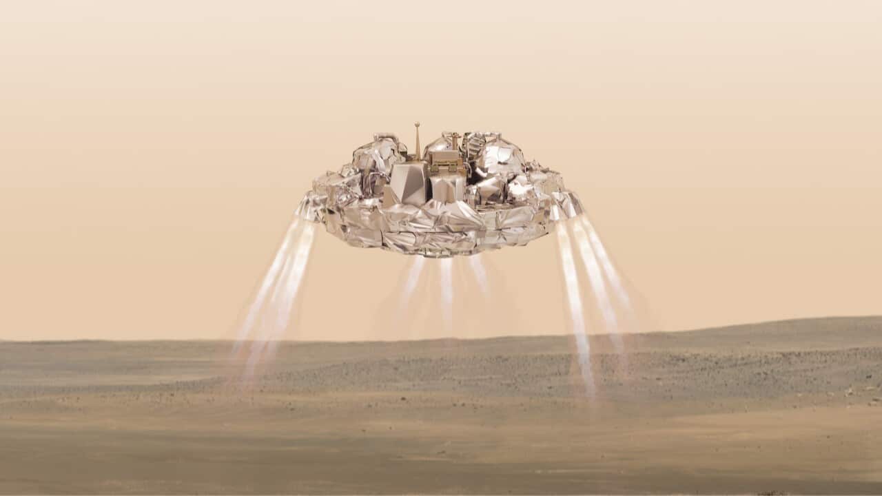 This artist impression provided by the European Space Agency, ESA, shows the Schiaparelli module with thrusters firing.