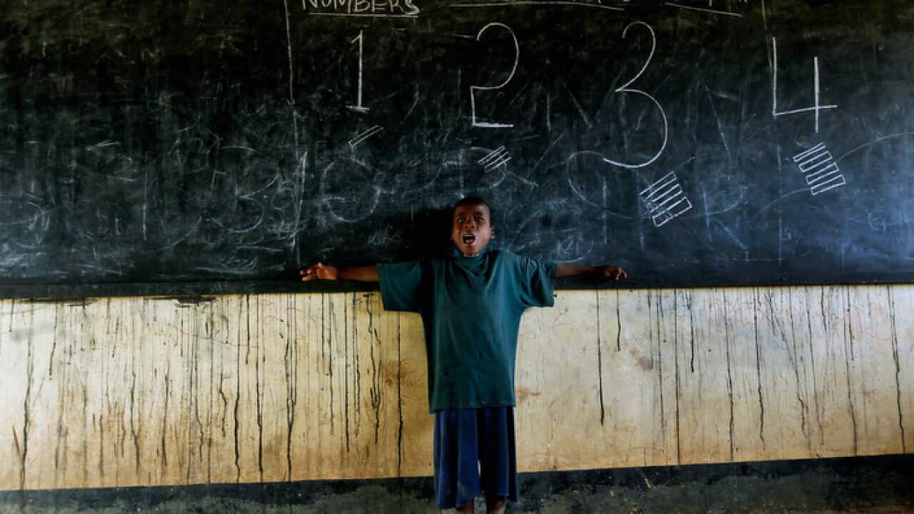 somali_student_singing_to_class_in_refugee_camp_aap_larger.jpg