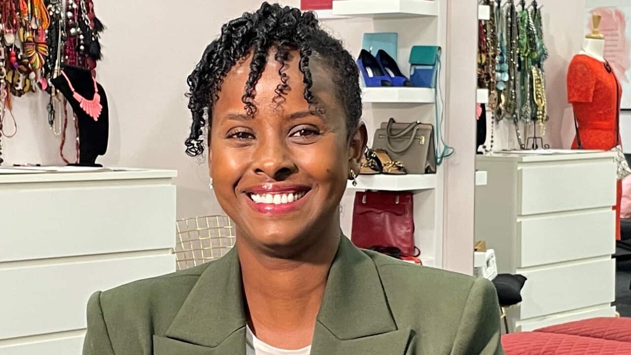 Naima Ibrahim sitting at Dress for Success in Sydney.