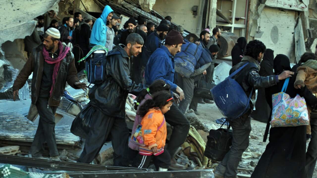 People are evacuated from Homs in Syria