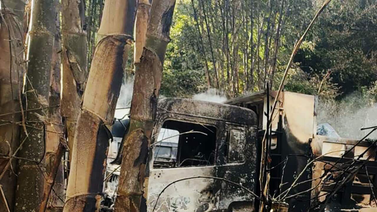 In this photo provided by the Karenni Nationalities Defense Force (KNDF), smokes and flames billow from vehicles in Hpruso township, Kayah state, Myanmar, Friday, Dec. 24, 2021.
