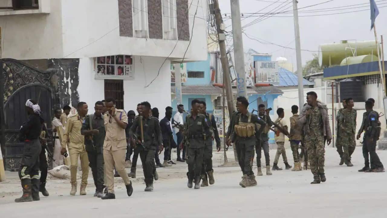 Security forces patrol the area outside the Hayat Hotel in the capital Mogadishu on 20 August 2022.jpg