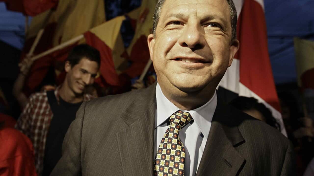 Centrist candidate Luis Guillermo Solis smiles.