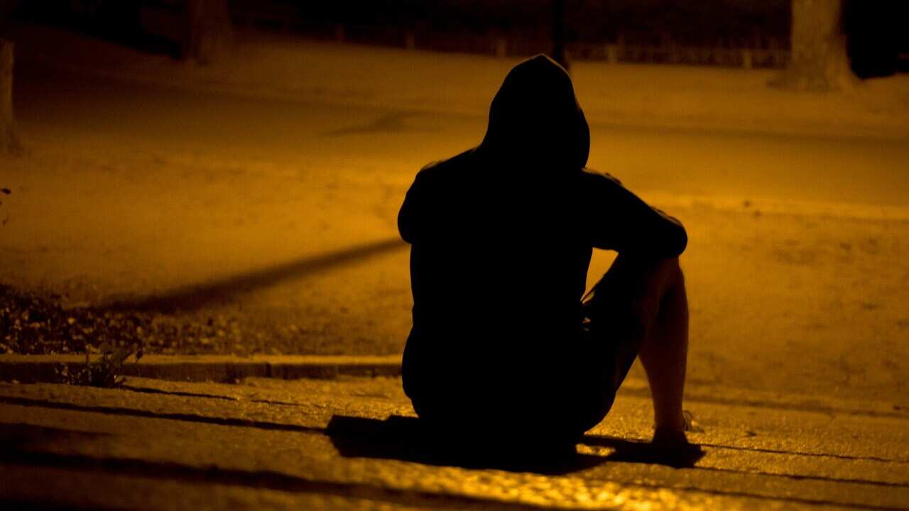 A lonely man sitting in the park