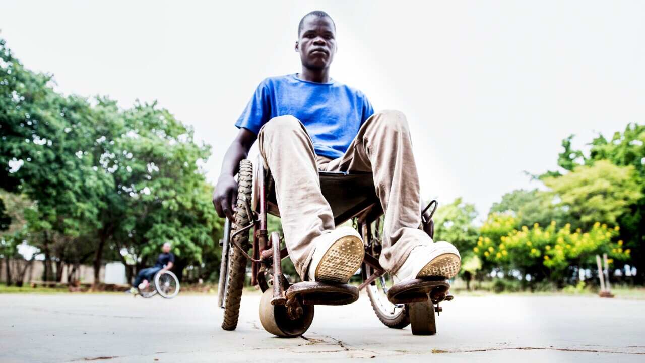 A Mid Adult African Man on the Wheelchair Looking at the Camera for a Portrait