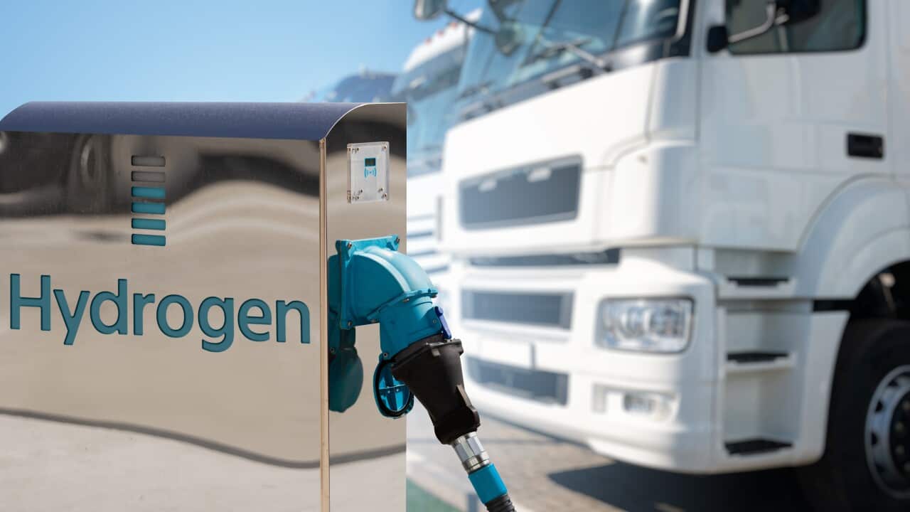 Hydrogen filling station on a background of trucks