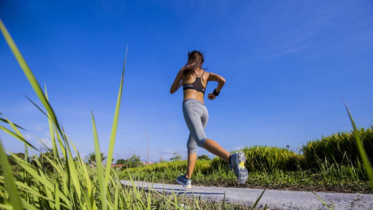 Running in rice field in Bali, Indonesia