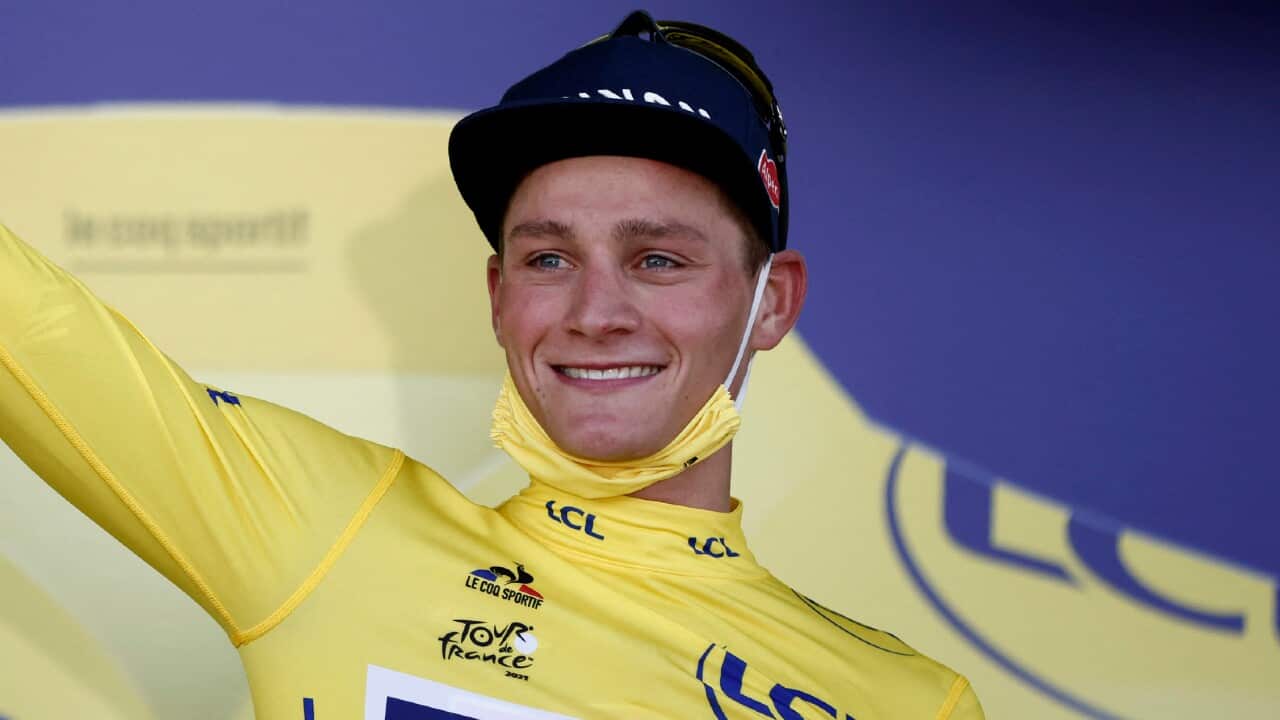 Mathieu van der Poel celebrates in the yellow jersey after Stage 2 of the Tour de France