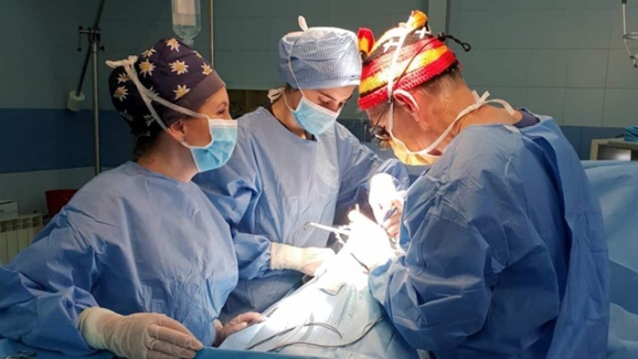 Dr Paddy Dewan during an operation