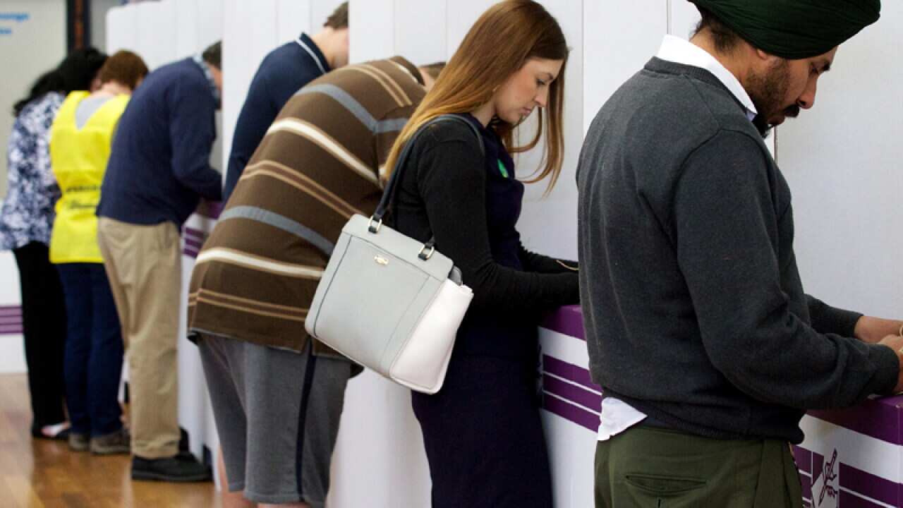 Members of the public casting their vote at Kelmscott High School