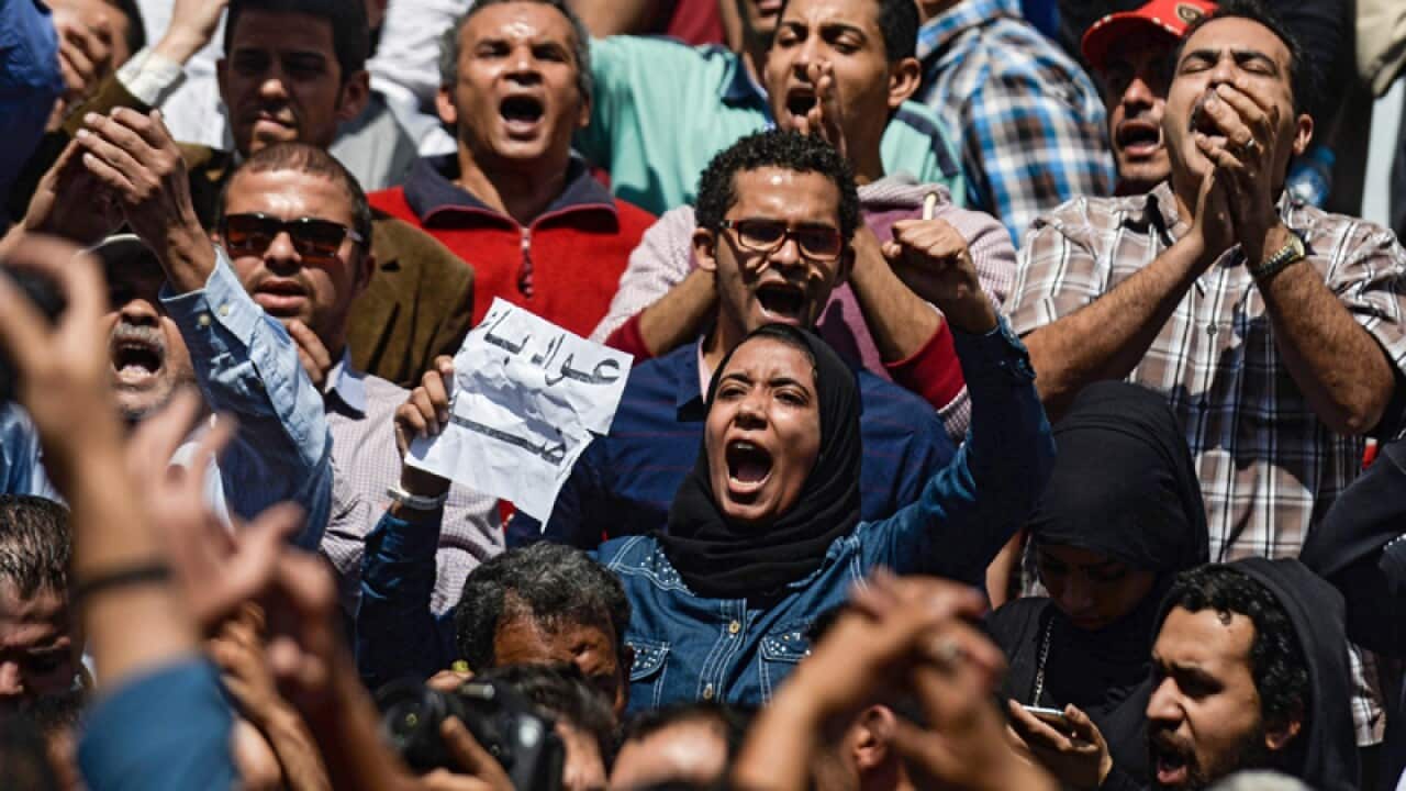 Egyptians protest in front of the Egyptian Journalists Syndicate