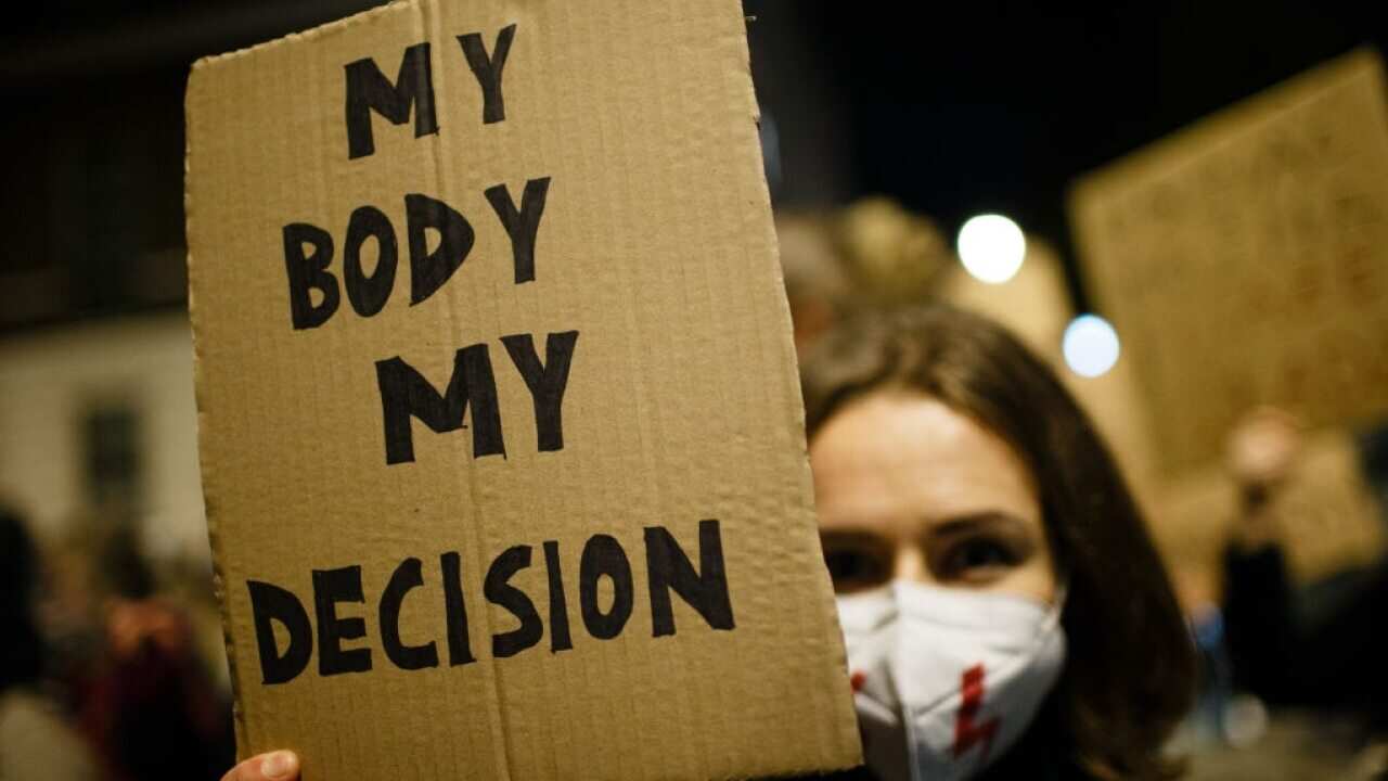 Opponents of Poland's new abortion restrictions demonstrate outside the Polish Embassy on Portland Place in London.