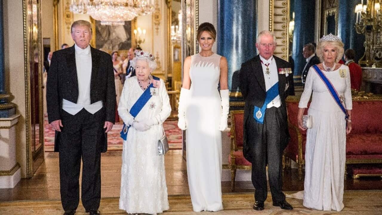 US President Donald Trump, left and Queen Elizabeth II make a toast during the State Banquet at Buckingham Palace, in London.