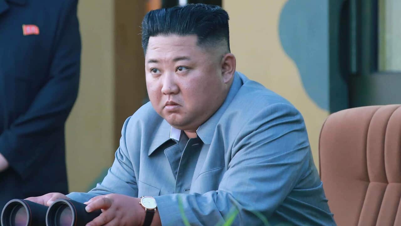 Kim Jong-un overseeing a weapon launch.