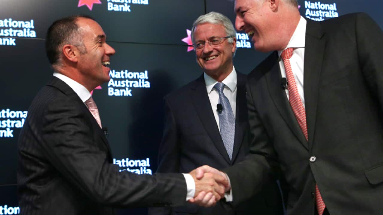 NAB CEO Cameron Clyne (R) and BNZ boss Andrew (L) Thorburn shake hands