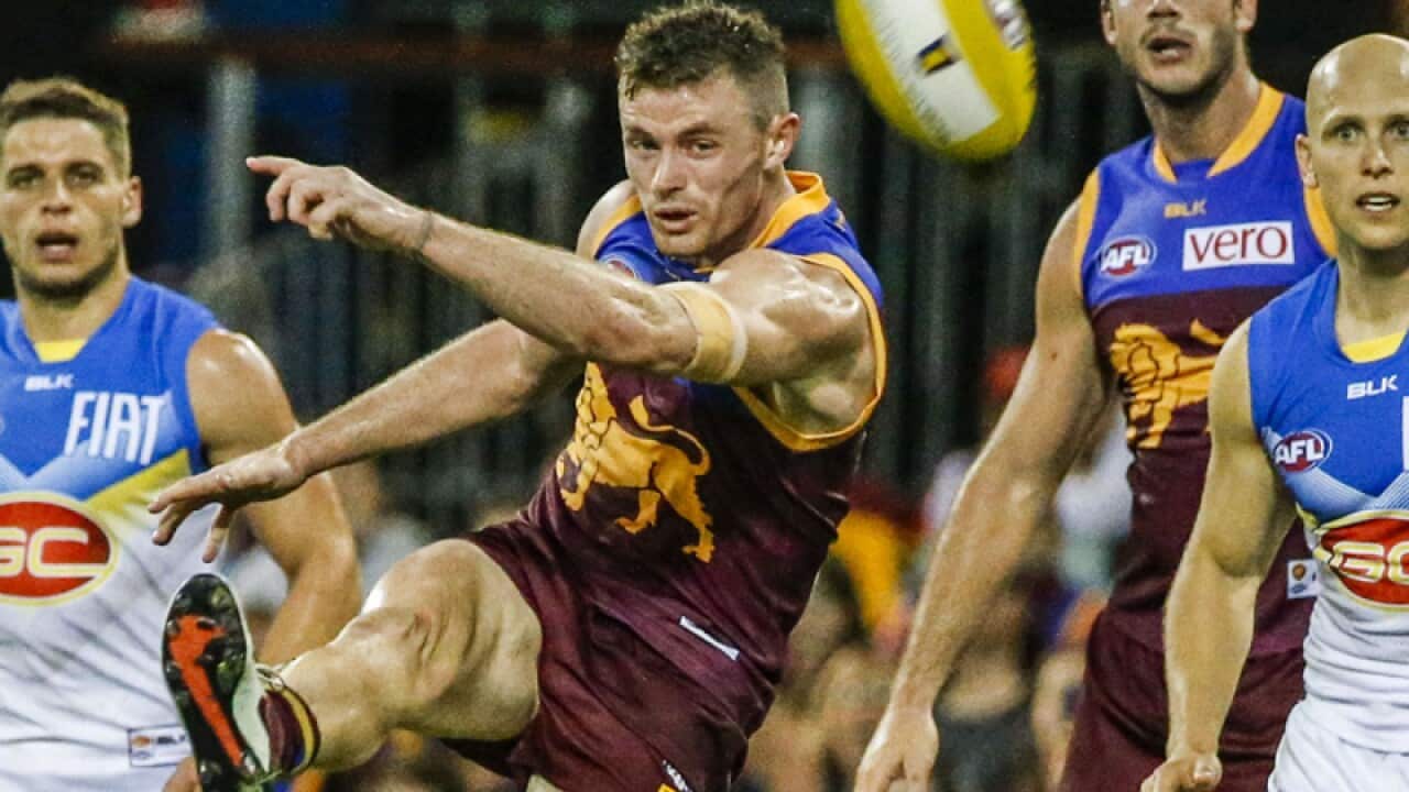 Former Brisbane Lions midfielder Pearce Hanley (C)