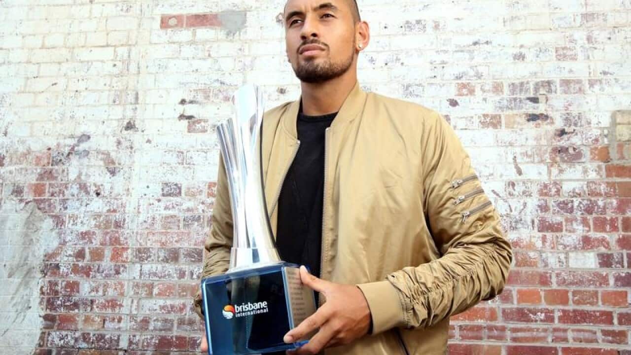 Tennis player Nick Kyrgios poses for the media