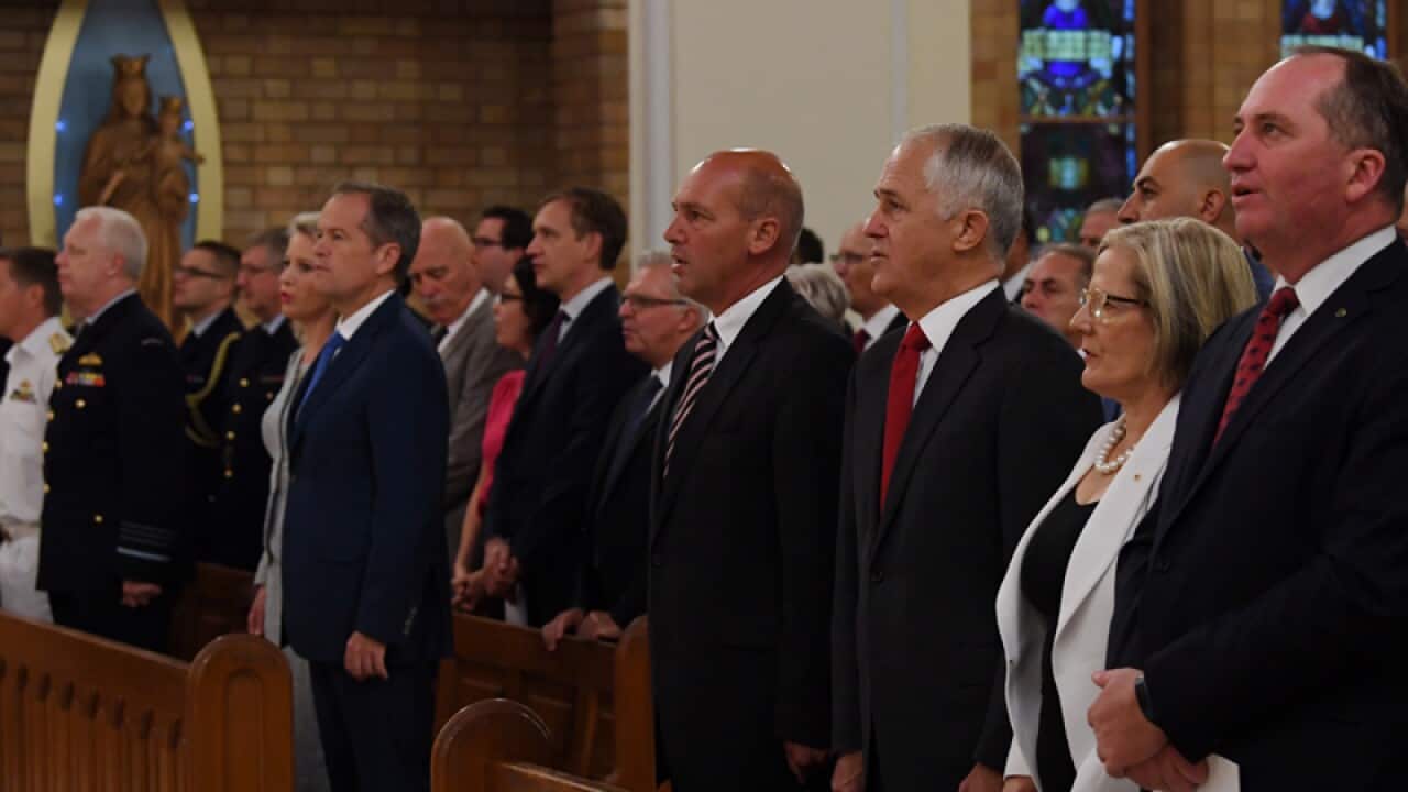 Bill Shorten (L) and Malcolm Turnbull (R) during a church service