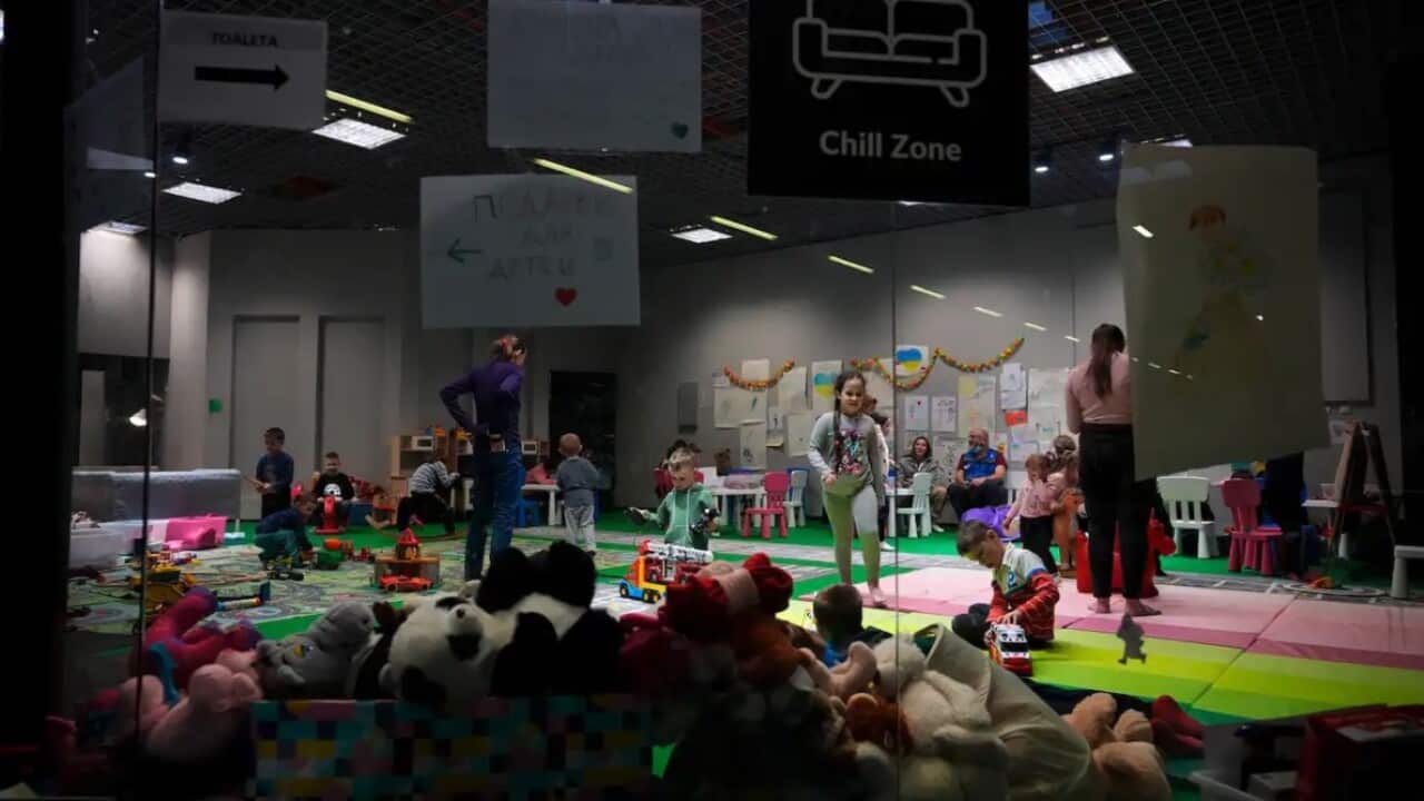 Children from Ukraine play at an exhibition hall, turned into a refugee center in Nadarzyn, near Warsaw, Poland, on 23 March 2022.
