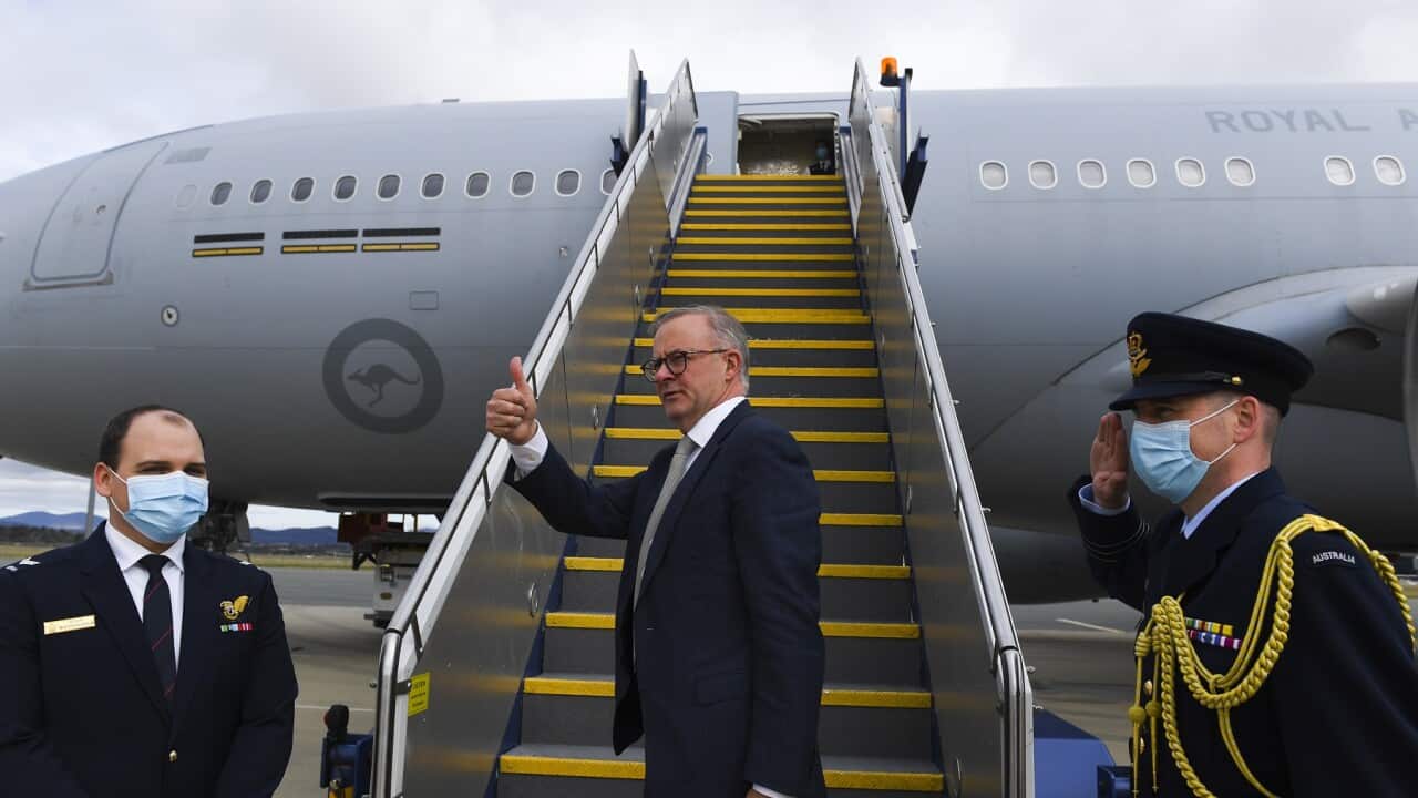 Australian Prime Minister Anthony Albanese boards the plane to Japan to attend the QUAD leaders meeting in Tokyo, Canberra, Monday, May 23, 2022. (AAP Image/Lukas Coch) NO ARCHIVING