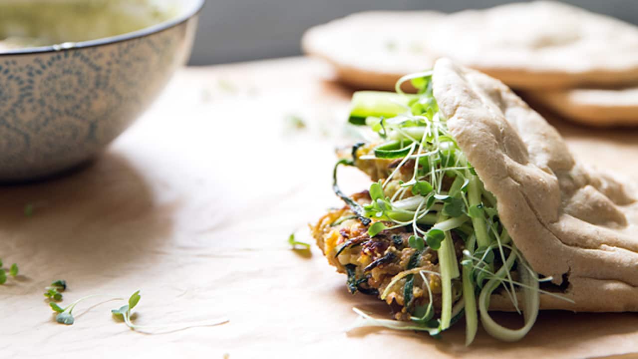 Zucchini, corn and sweet potato fritters with pita