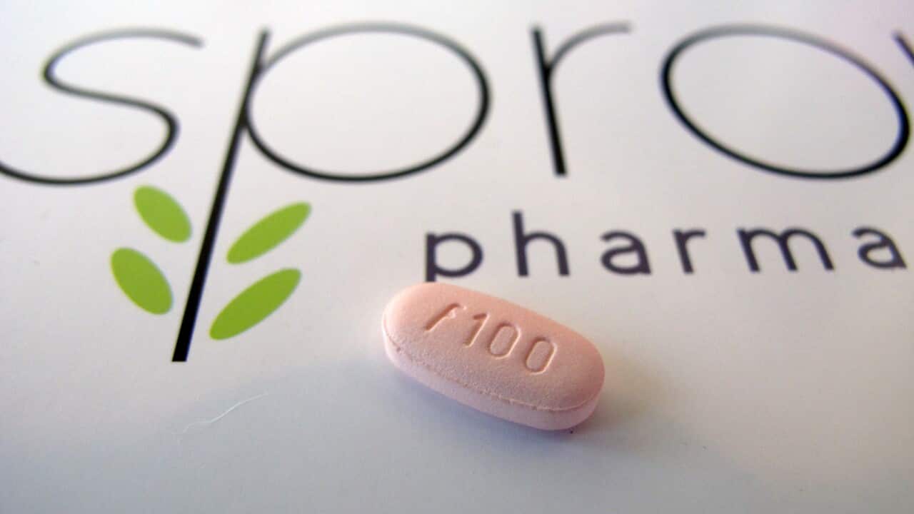 A tablet of flibanserin sits on a brochure for Sprout Pharmaceuticals in the company's Raleigh, N.C., headquarters. (AP Photo/Allen G. Breed)