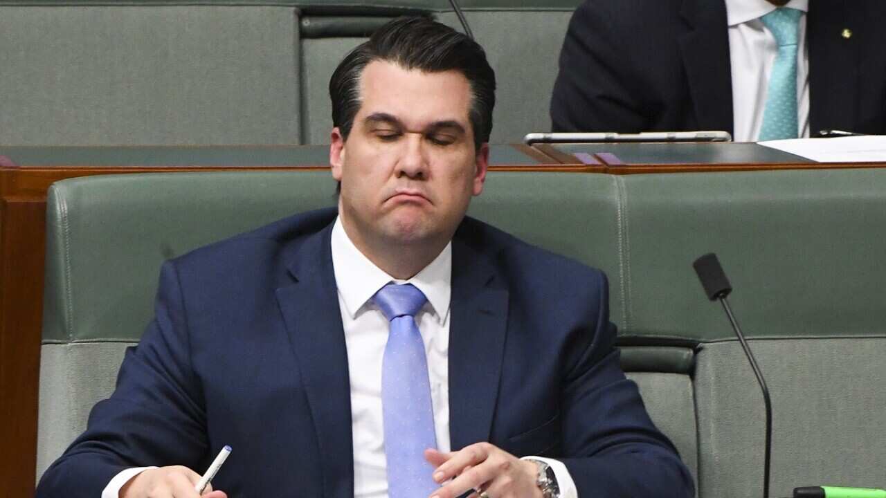 Australian Assistant Treasurer Michael Sukkar (top) listens to PM Scott Morrison during Question Time