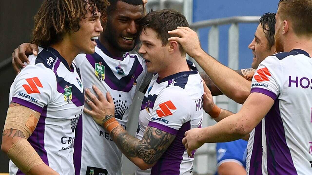 Melbourne Storm players celebrate