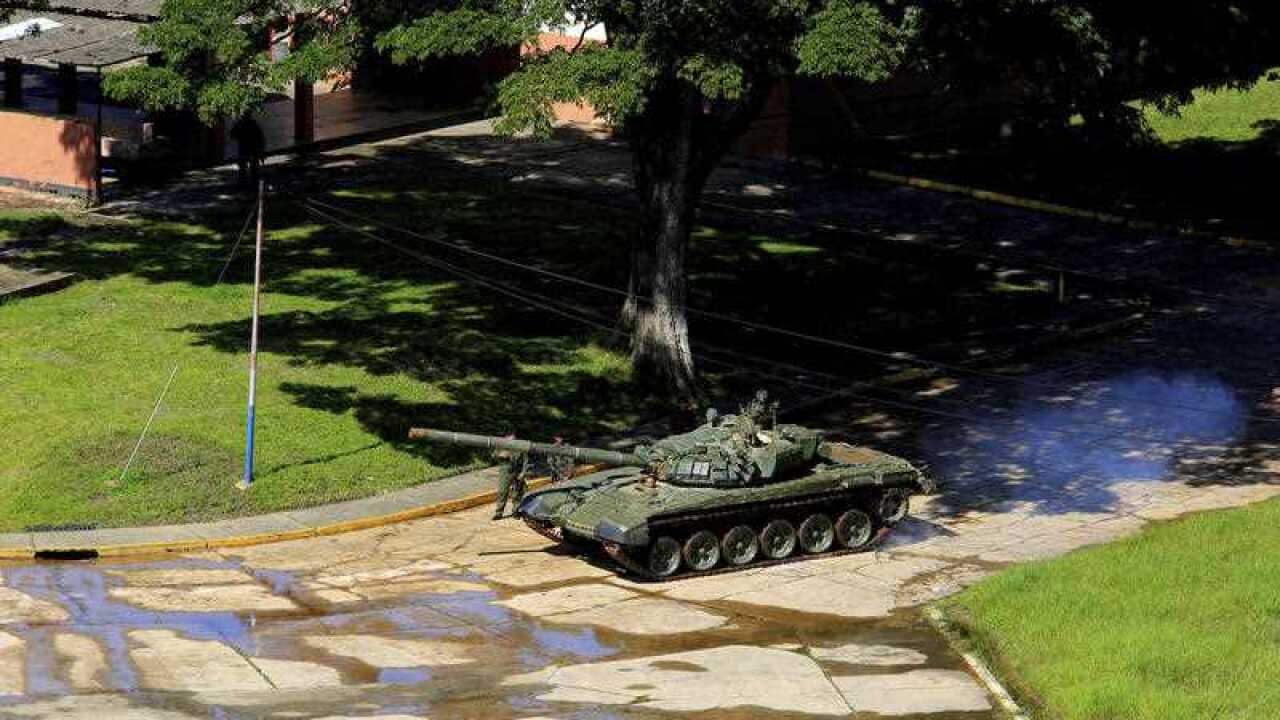 A tank of the Venezuelan Bolivarian National Army moves inside the military base Paramacay in Valencia, Venezuela.