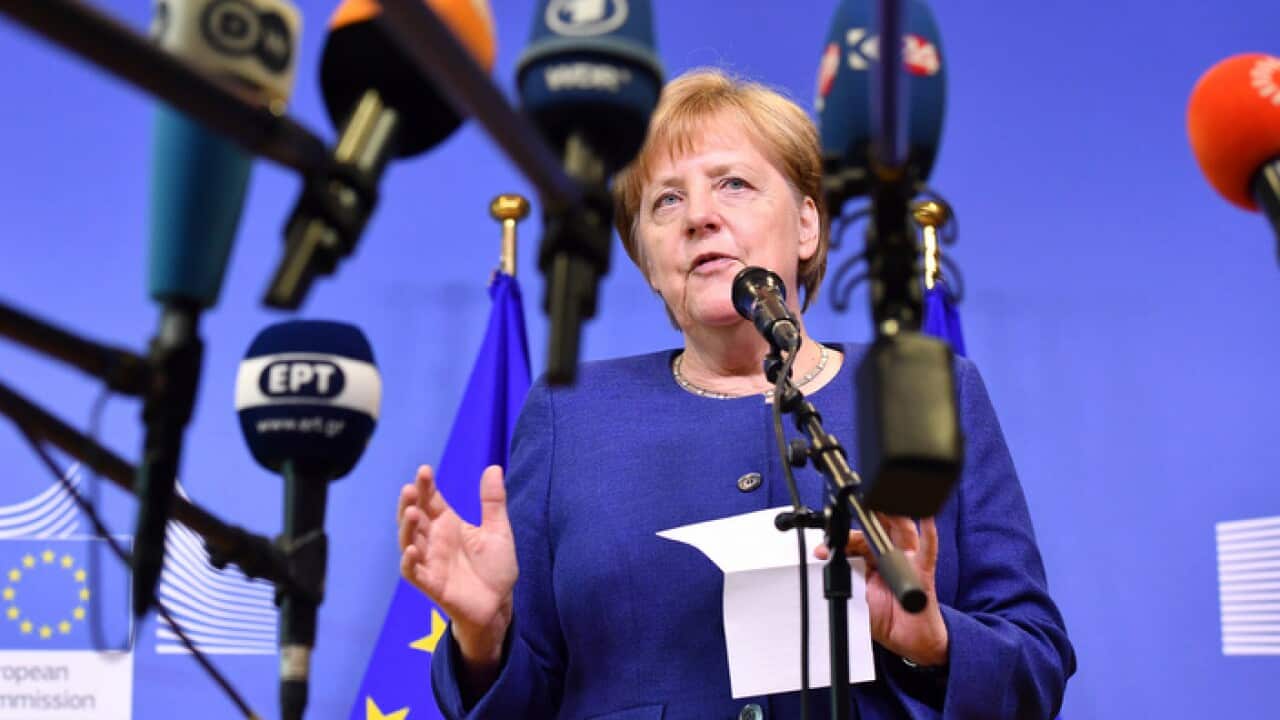 German Chancellor Angela Merkel speaks with the media at the conclusion of an informal EU summit on migration at EU headquarters in Brussels, Sunday, June 24, 2018. (AP Photo/Geert Vanden Wijngaert)