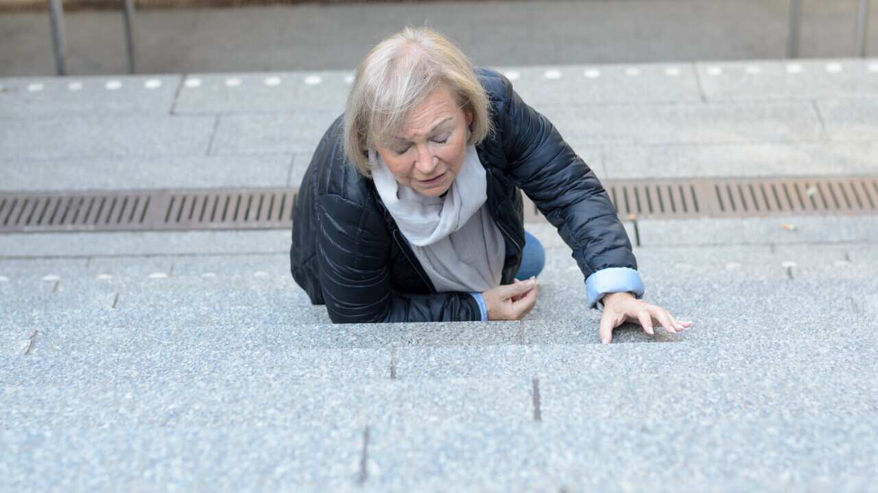 An older lady who has fallen up some steps