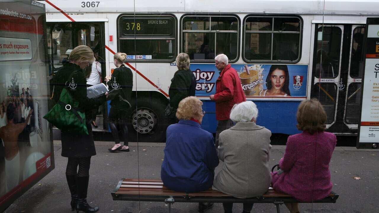 Elderly women wait to catch a bus on Eddy Avenue near Central Station in Sydney, Wednesday, June 1, 2011. (AAP Image/Angela Brkic) NO ARCHIVING