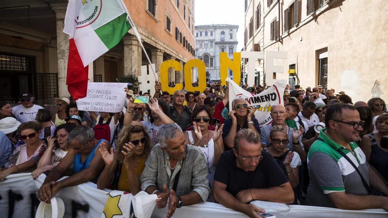 Supporters of the Five Star Movement (M5S) rally outside the Senate where Italian Prime Minister Conte is addressing the Parliament in Rome.