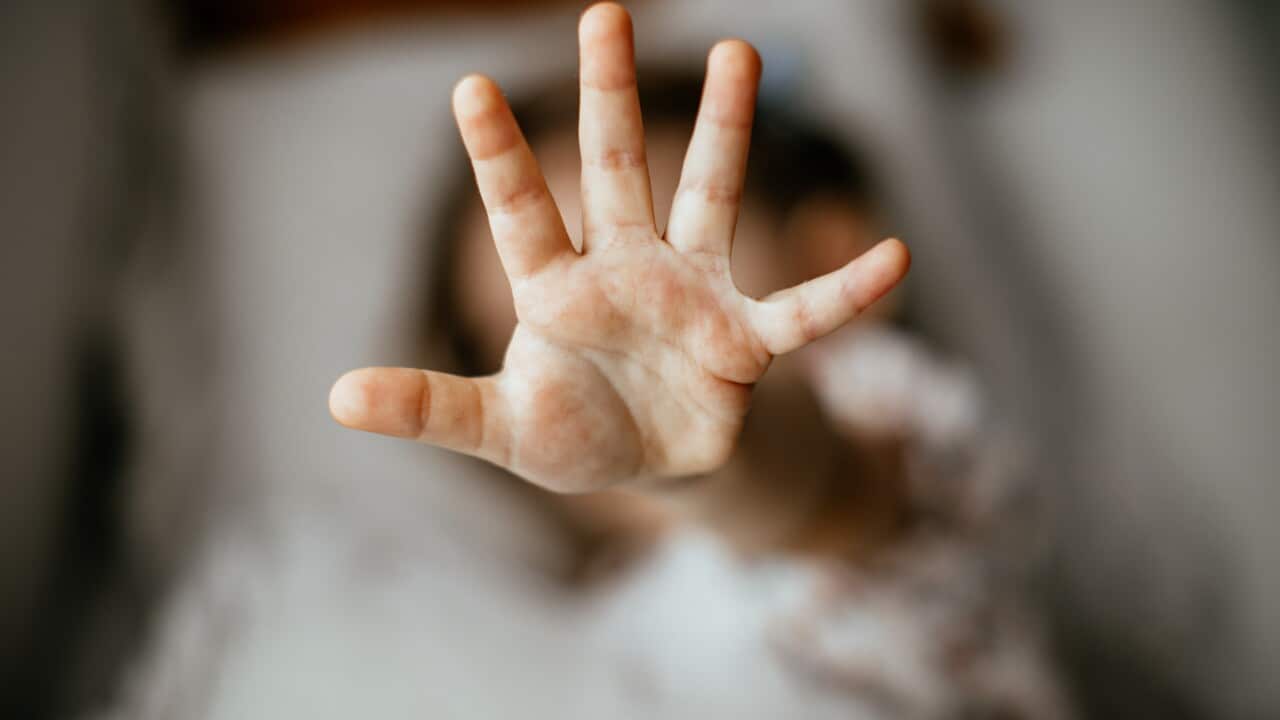 Girl making stop gesture