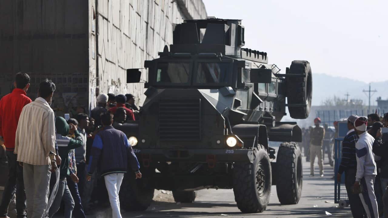 At least four gunmen entered an Indian air force base near the border with Pakistan on Saturday morning and exchanged fire with security forces, leaving two of them dead, officials said. (AP Photo/Channi Anand)