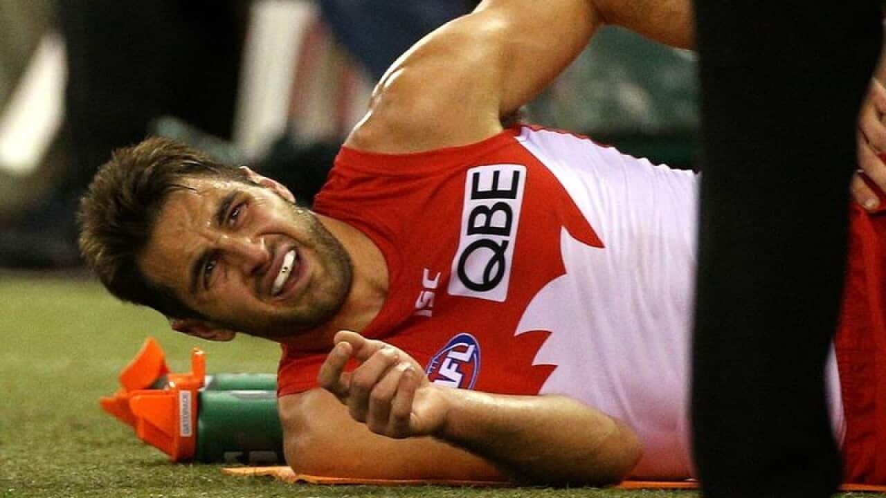 A file image of Josh Kennedy of the Swans injured on the field.