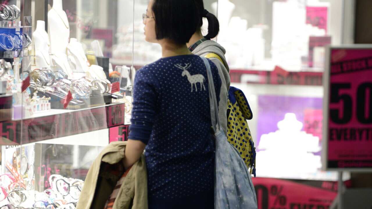 Two women window-shop