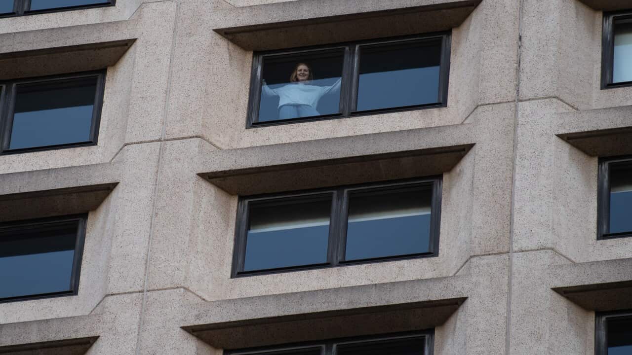 A returned traveller from the United States in isolation, seen from a window of the Intercontinental Hotel in Sydney.