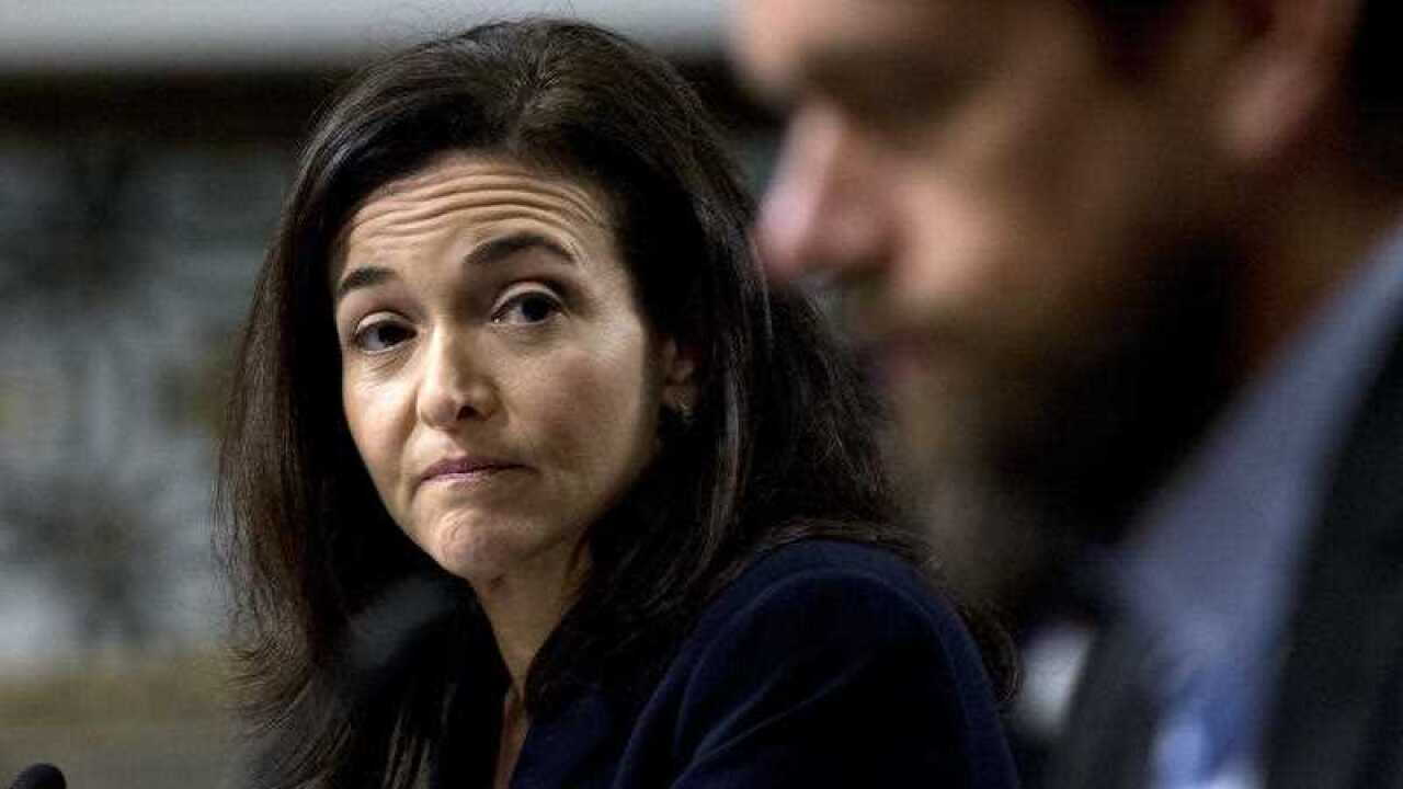 Facebook COO Sheryl Sandberg accompanied by Twitter CEO Jack Dorsey, right, before the Senate Intelligence Committee hearing