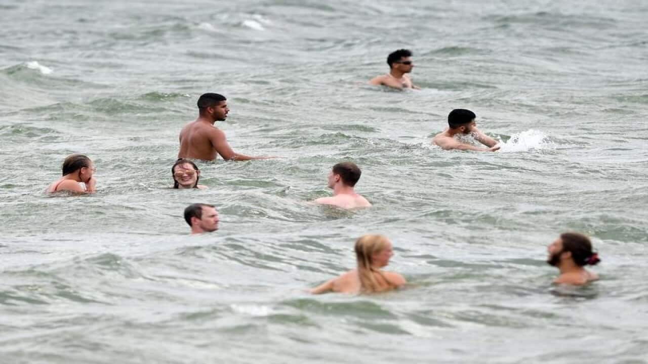 Swimmers at St Kilda beach in Melbourne.
